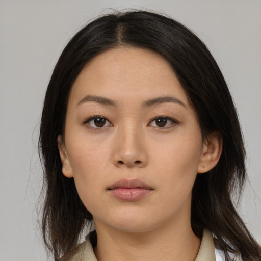 Neutral latino young-adult female with medium  brown hair and brown eyes