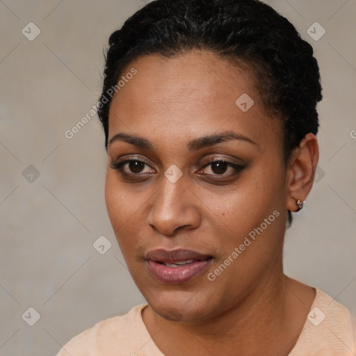 Joyful black young-adult female with short  black hair and brown eyes