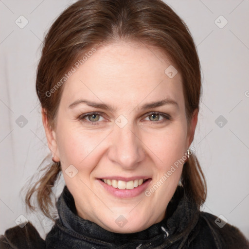 Joyful white adult female with medium  brown hair and grey eyes