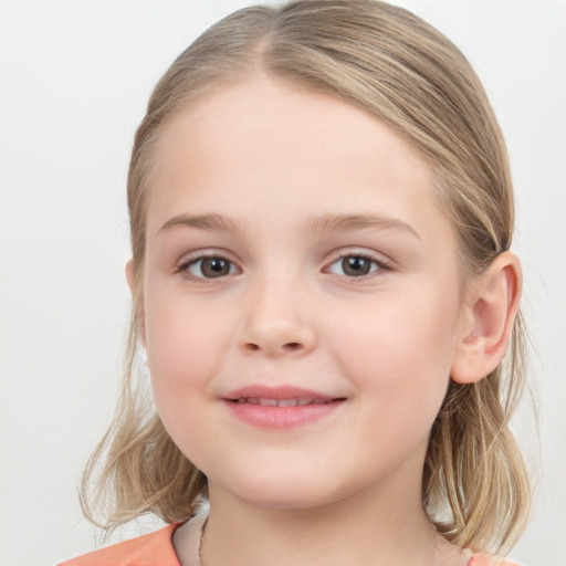 Joyful white child female with medium  brown hair and grey eyes