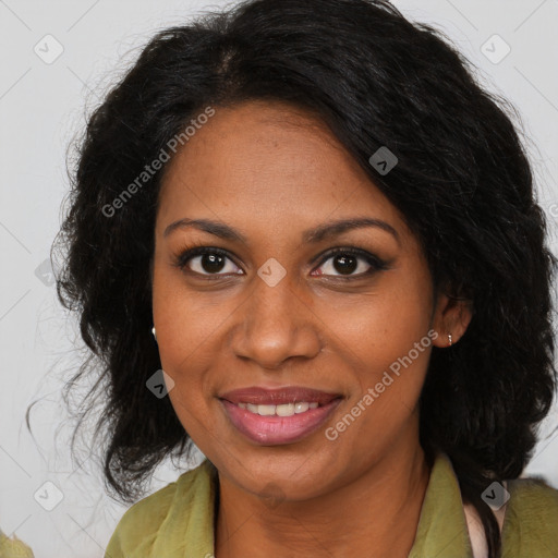 Joyful black adult female with medium  brown hair and brown eyes