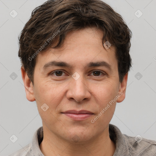 Joyful white adult male with short  brown hair and grey eyes