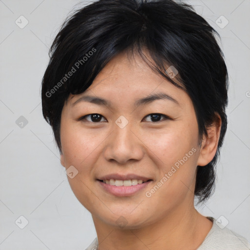 Joyful asian young-adult female with medium  black hair and brown eyes