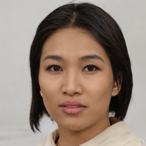 Neutral asian young-adult female with medium  black hair and brown eyes