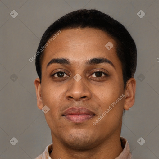 Joyful black young-adult male with short  brown hair and brown eyes