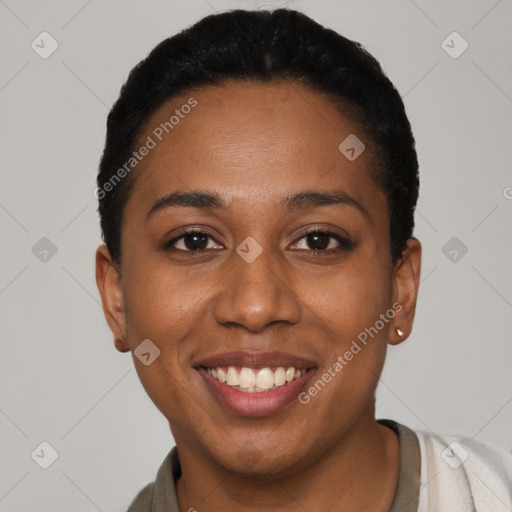 Joyful black young-adult female with short  black hair and brown eyes