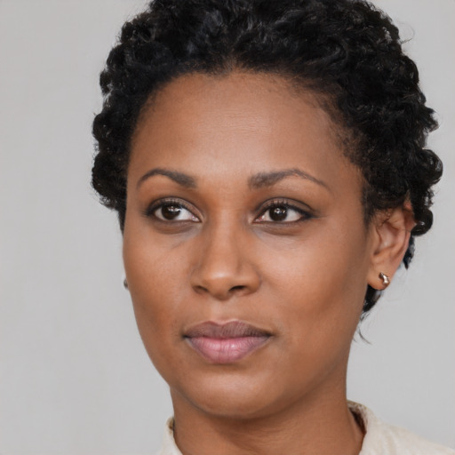 Neutral black young-adult female with short  brown hair and brown eyes