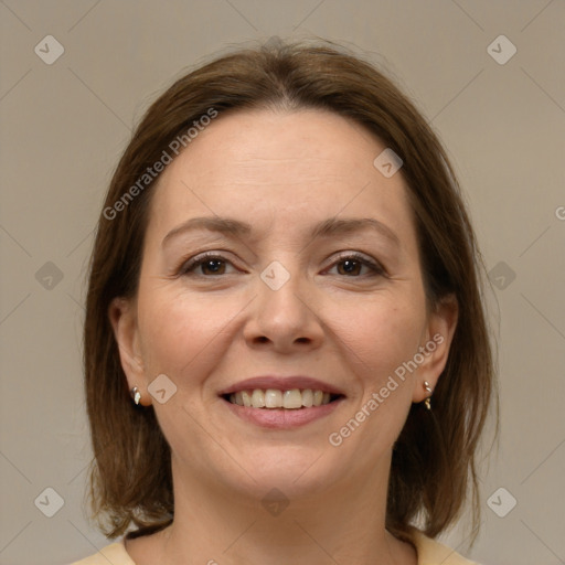 Joyful white adult female with medium  brown hair and brown eyes