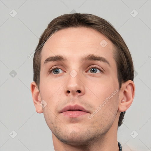 Neutral white young-adult male with short  brown hair and grey eyes