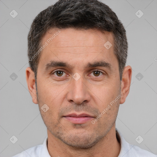 Neutral white adult male with short  brown hair and brown eyes