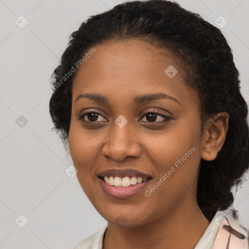 Joyful black young-adult female with medium  brown hair and brown eyes