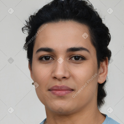 Joyful latino young-adult female with short  black hair and brown eyes