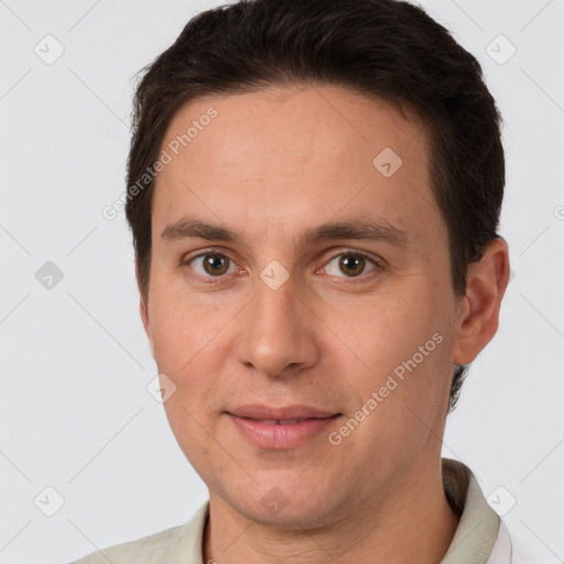 Joyful white young-adult male with short  brown hair and brown eyes