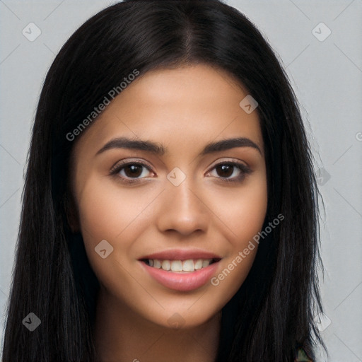 Joyful latino young-adult female with long  brown hair and brown eyes