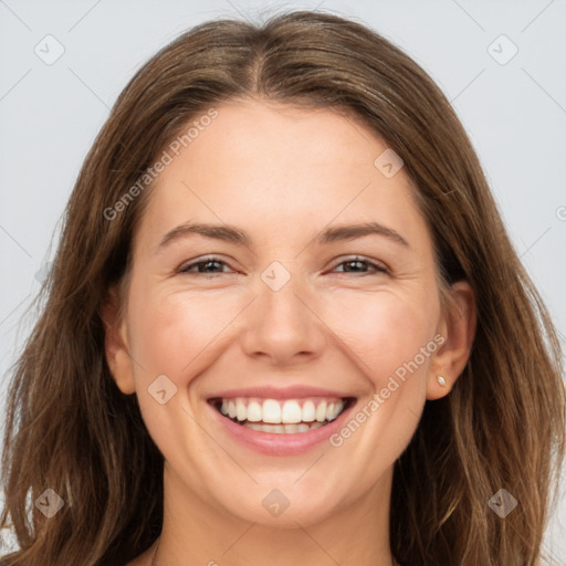 Joyful white young-adult female with long  brown hair and grey eyes