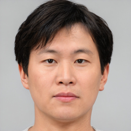 Neutral asian young-adult male with short  brown hair and brown eyes