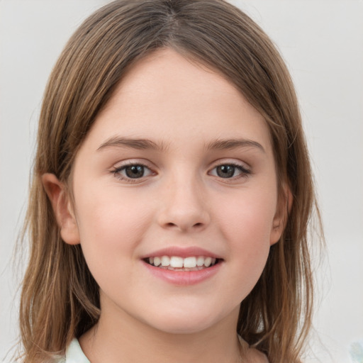 Joyful white child female with medium  brown hair and grey eyes