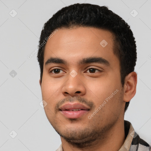 Neutral latino young-adult male with short  black hair and brown eyes