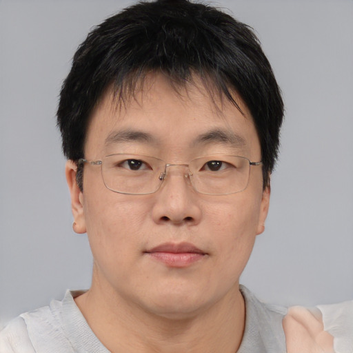 Neutral asian young-adult male with short  brown hair and brown eyes
