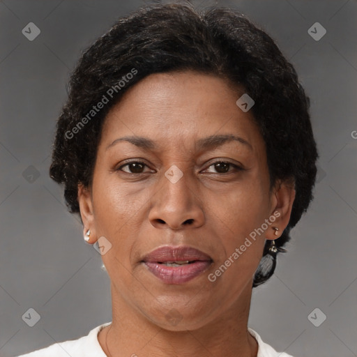 Joyful black adult female with short  brown hair and brown eyes