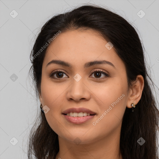 Joyful latino young-adult female with long  brown hair and brown eyes