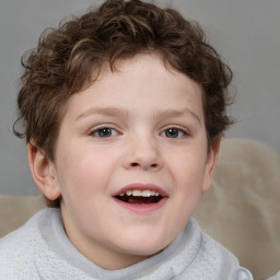 Joyful white child male with short  brown hair and brown eyes