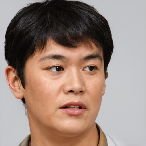Neutral asian young-adult male with short  brown hair and brown eyes
