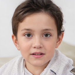 Joyful white child female with short  brown hair and brown eyes