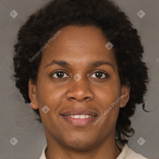 Joyful black adult female with short  brown hair and brown eyes