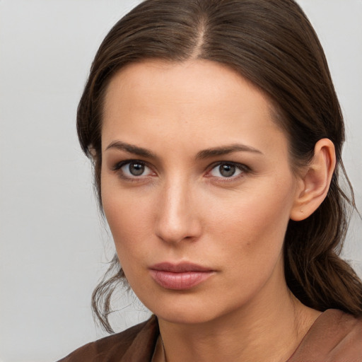 Neutral white young-adult female with long  brown hair and brown eyes