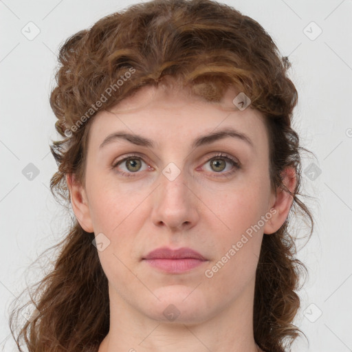 Joyful white young-adult female with medium  brown hair and green eyes