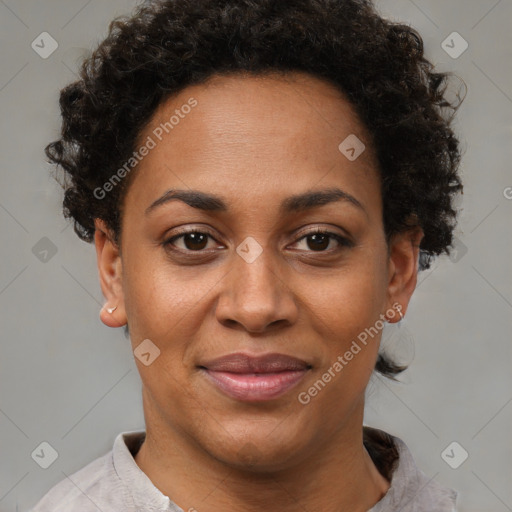 Joyful black adult female with short  brown hair and brown eyes