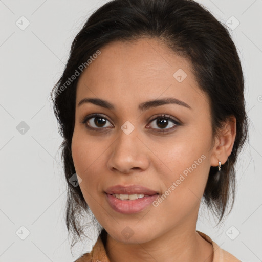 Joyful latino young-adult female with medium  brown hair and brown eyes