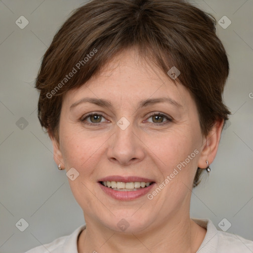 Joyful white adult female with medium  brown hair and grey eyes