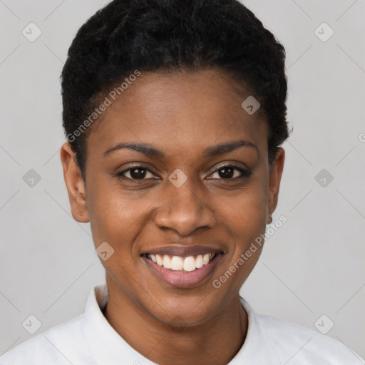 Joyful black young-adult female with short  brown hair and brown eyes