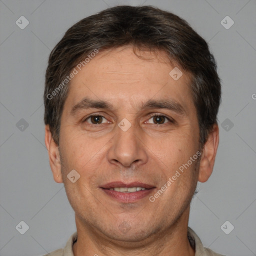 Joyful white adult male with short  brown hair and brown eyes