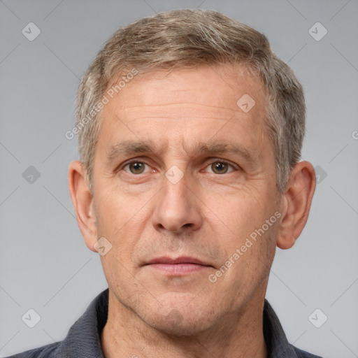 Neutral white middle-aged male with short  brown hair and grey eyes