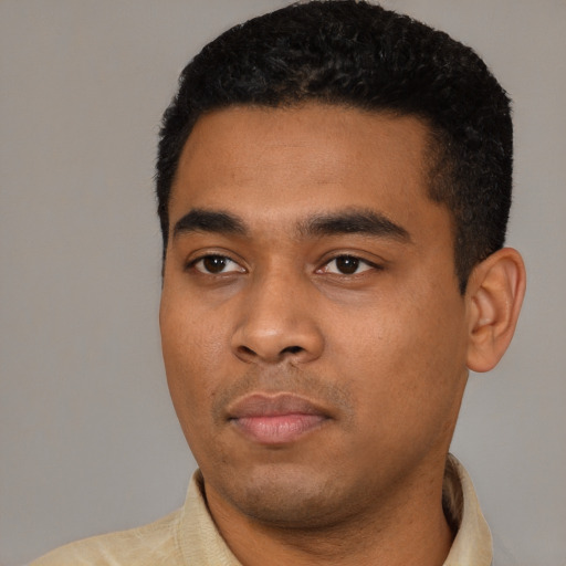 Neutral latino young-adult male with short  black hair and brown eyes