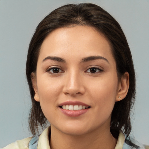 Joyful white young-adult female with medium  brown hair and brown eyes