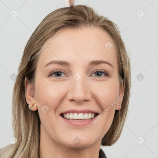 Joyful white young-adult female with long  brown hair and grey eyes