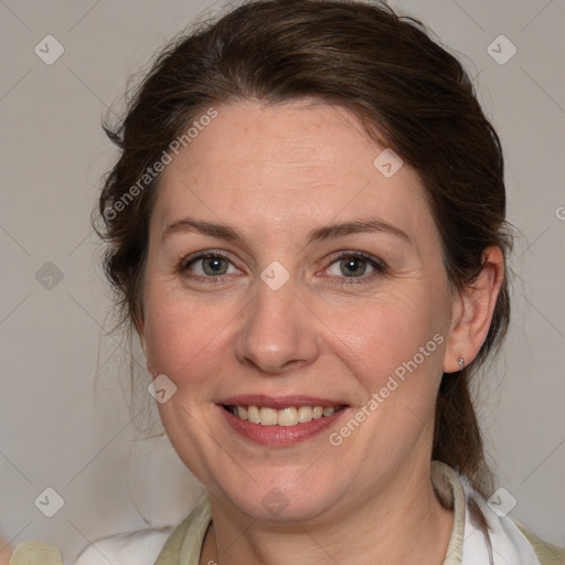 Joyful white adult female with medium  brown hair and blue eyes