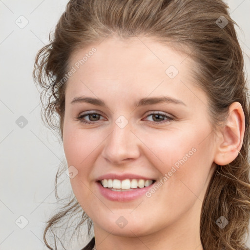 Joyful white young-adult female with long  brown hair and grey eyes