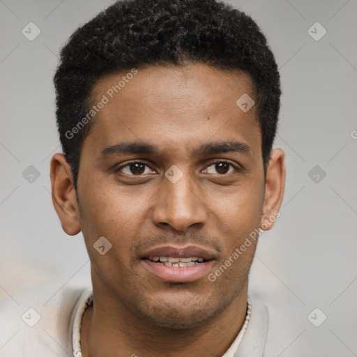 Joyful black young-adult male with short  brown hair and brown eyes