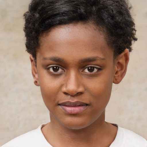 Joyful black child female with short  brown hair and brown eyes