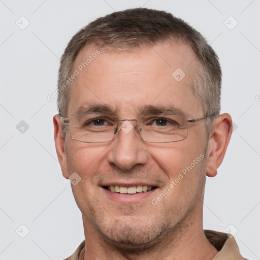 Joyful white adult male with short  brown hair and brown eyes