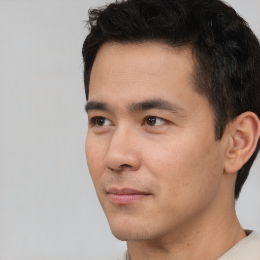 Neutral white young-adult male with short  black hair and brown eyes