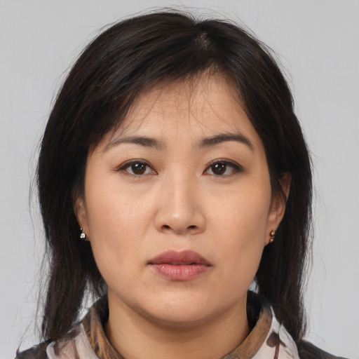 Neutral asian young-adult female with medium  brown hair and brown eyes