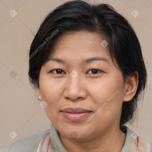 Joyful asian adult female with medium  brown hair and brown eyes