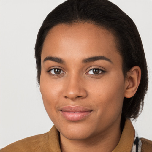 Joyful latino young-adult female with long  brown hair and brown eyes