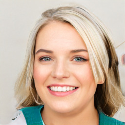 Joyful white young-adult female with medium  brown hair and blue eyes